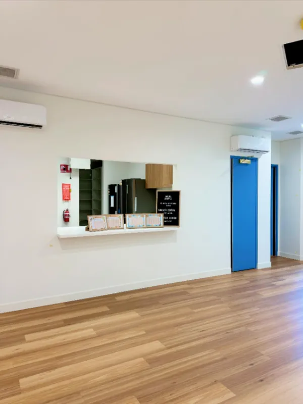 Welcome area at Amara Balga with kitchen view and menu boards, designed to welcome families into a modern facility.