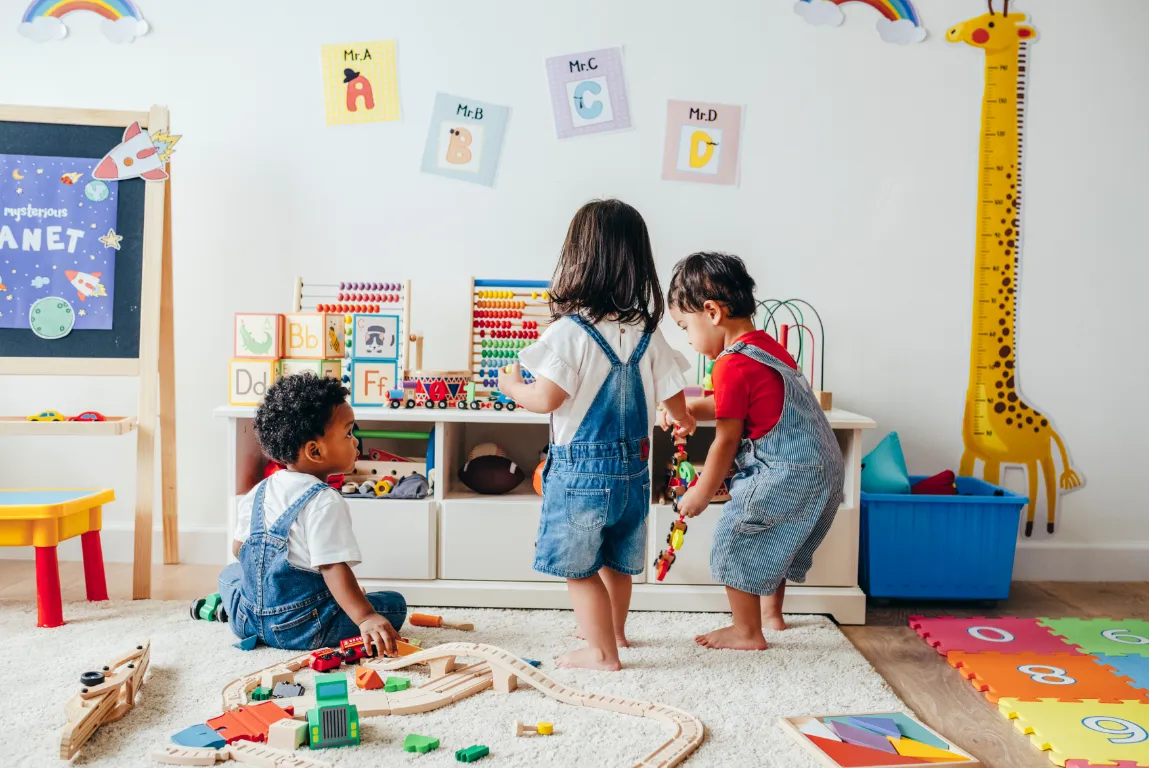 Toddlers exploring the Giraffe Room, learning through hands-on play and colourful educational activities